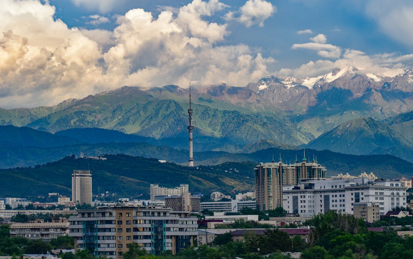 Almaty city with snow-capped mountains